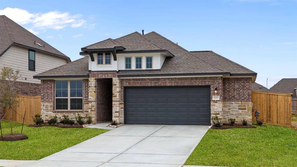 Welcome home to 32311 Tallow Creek Drive located in the Oakwood Estates community zoned to Waller ISD.