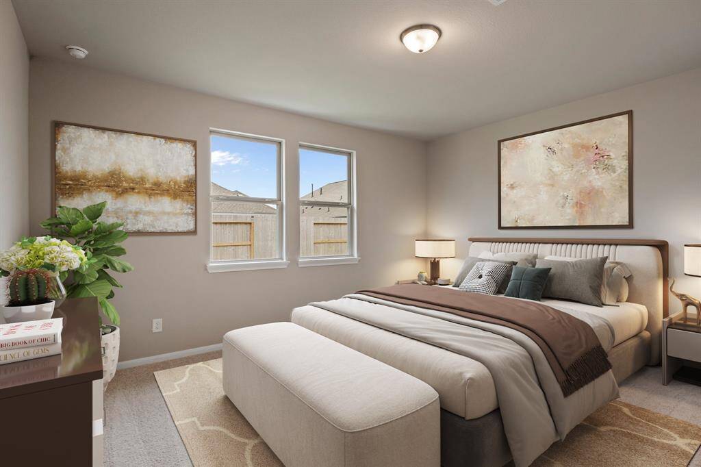 The primary bedroom is generously sized, creating a tranquil and spacious retreat that offers ample room for relaxation. Featuring plush carpet, high ceilings, fresh paint, and large windows that lets in natural lighting throughout the day.