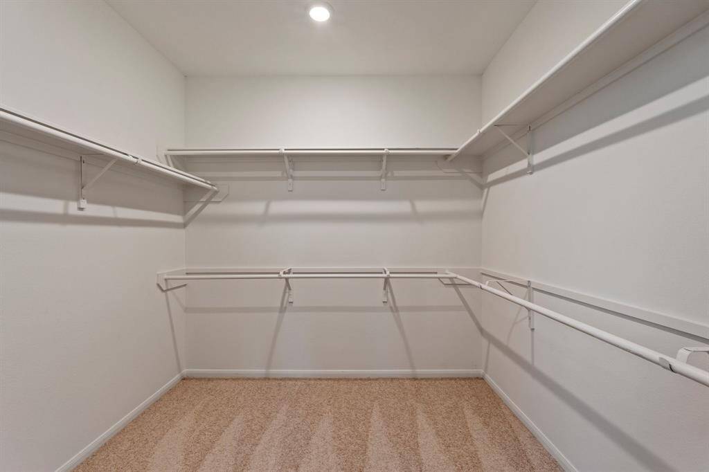 A view of your large primary walk-in Closet
