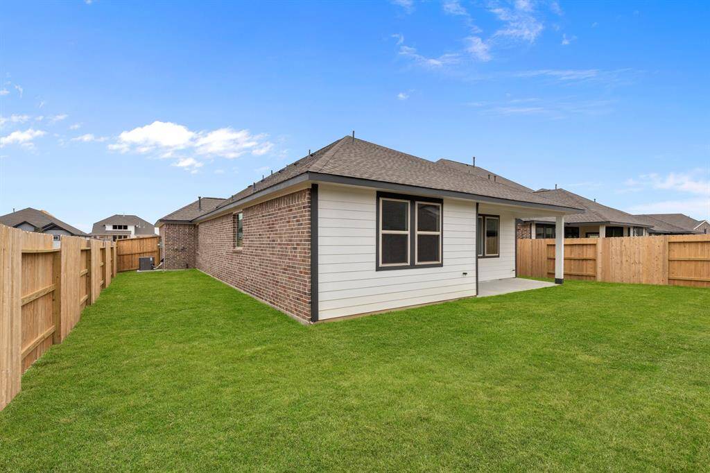 This backyard is perfect for family gatherings, social events, or simply unwinding in the fresh air.
