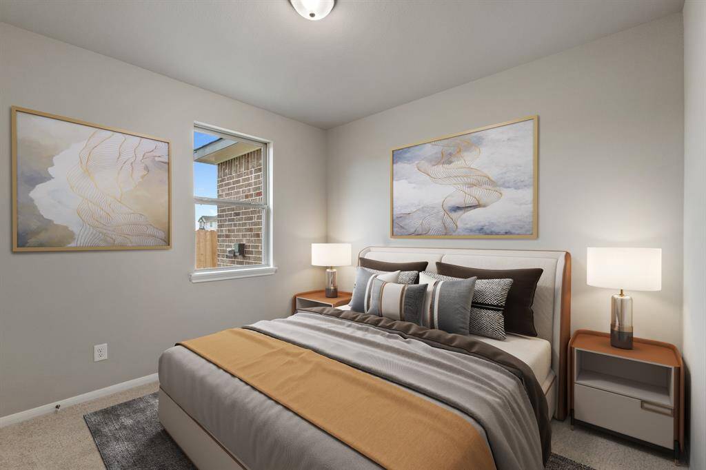 Your secondary bedroom features plush carpet, fresh paint, closet, and a large window that lets in plenty of natural lighting.