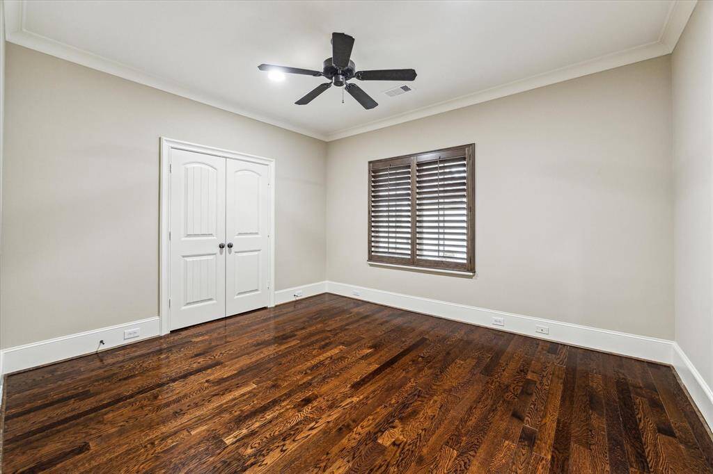 The third bedroom offers hardwood floors, a window with plantation shutters overlooking the front of home, 9’ ceiling with fan, ample-sized closet with double doors, and Ensuite bath.