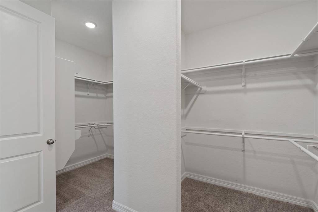 A view of your large primary walk-in Closet