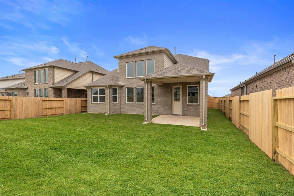 This backyard is perfect for family gatherings, social events, or simply unwinding in the fresh air.