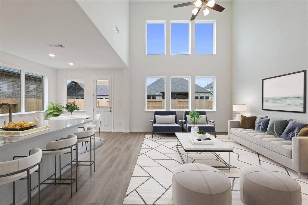This home boasts a spacious open concept layout that combines the best of modern design and comfort for everyday living. Photo is virtually staged