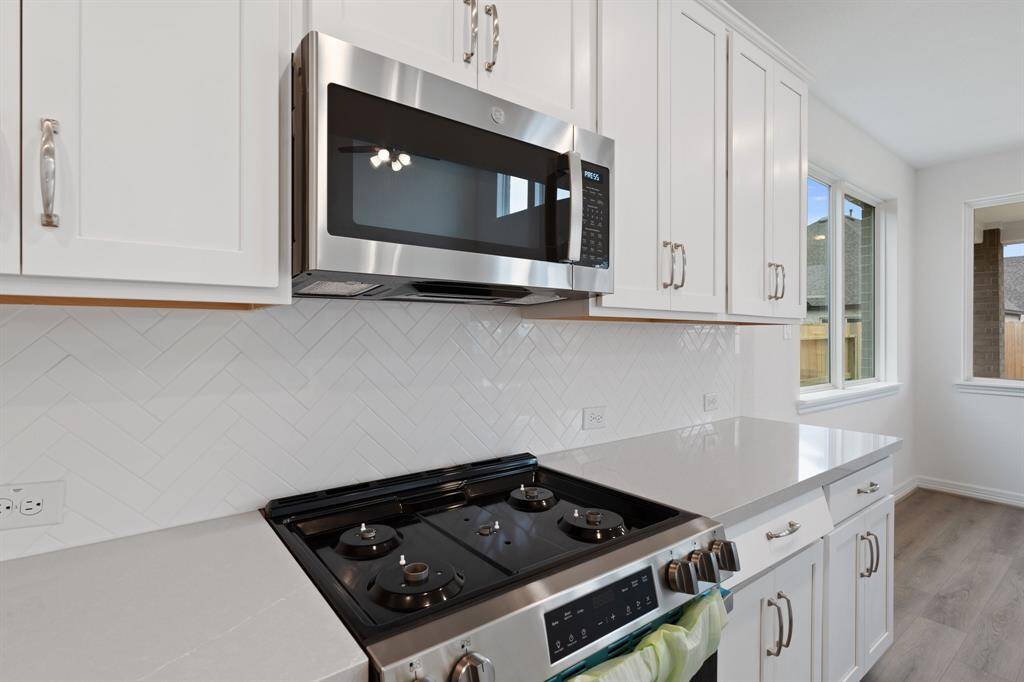 This kitchen is not only a functional space but also has ample storage. Whether you're a seasoned chef or just love to gather and enjoy good food, this kitchen is a dream come true. Photo is virtually staged