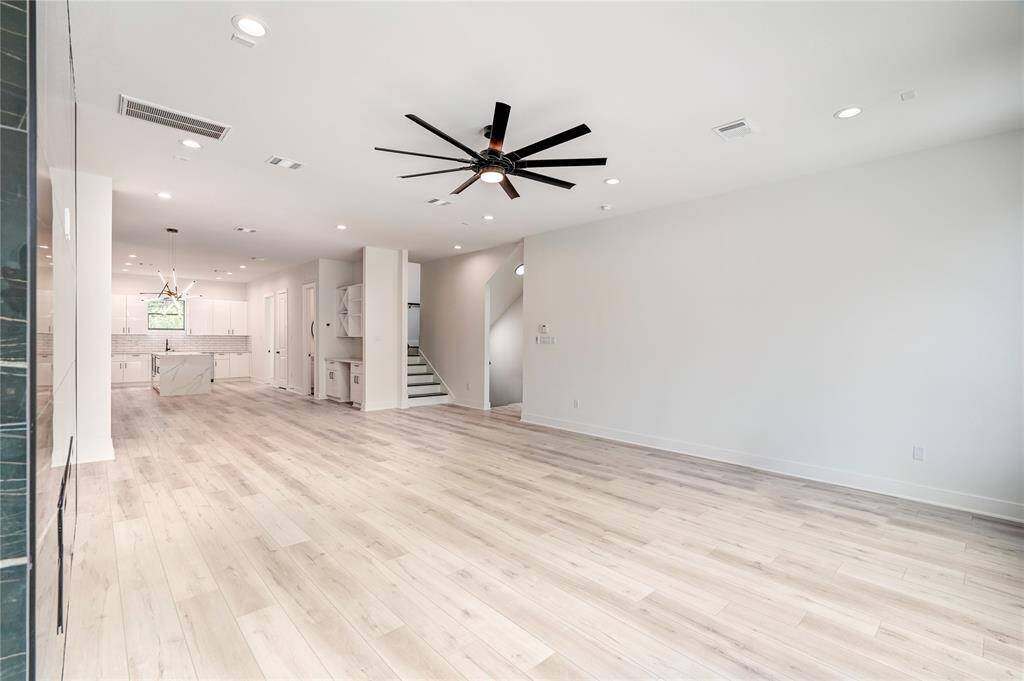 The living room has an electric fireplace for ambiance and is pre-wired for surround sound