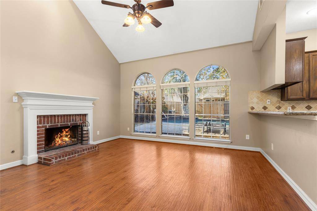 The family room invites you to enjoy the fireplace while admiring the pool!