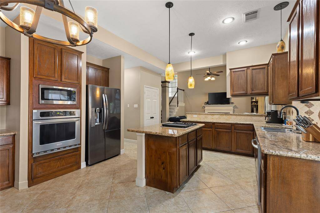 The Kitchen has plenty of counter space, and cabinetry for storage!