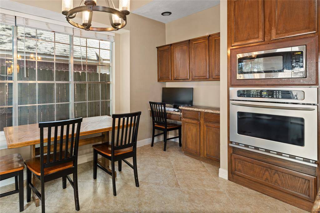 Large windows invite the sunshine in while you sip your coffee or enjoy your friends and family at the eat in kitchen table