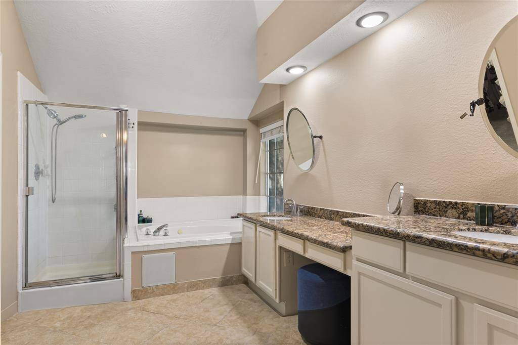 Primary Bathroom enjoys two sinks.
