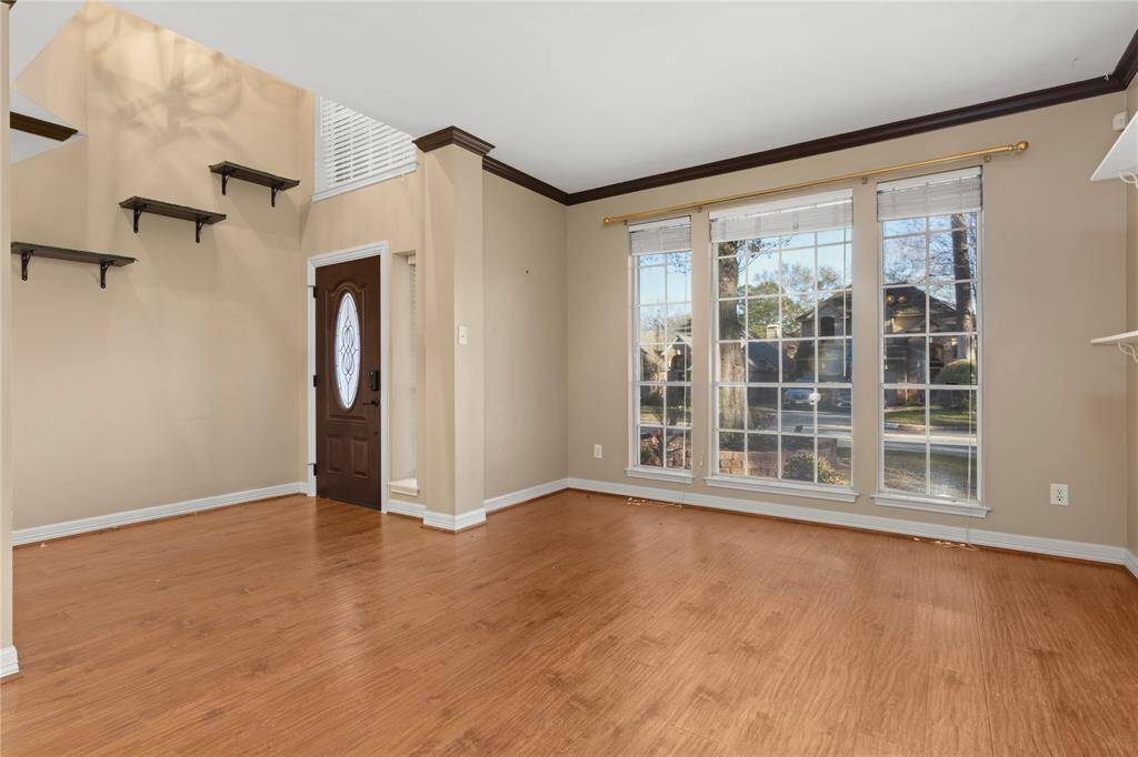 The Formal rooms invite you in to stay.  Large windows and very spacious.