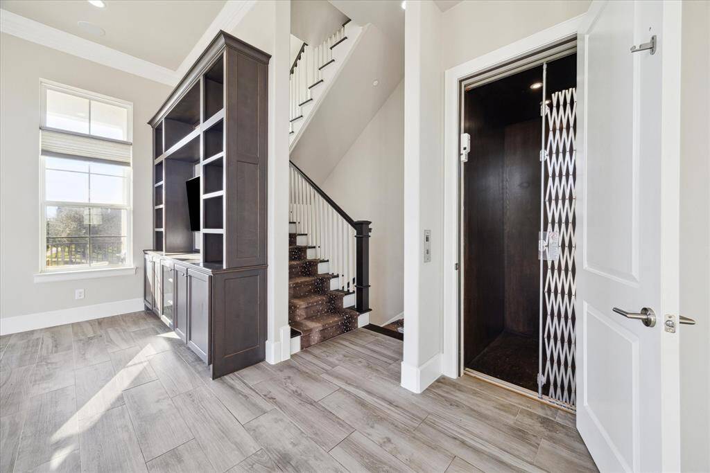 A private elevator or stately staircase ascends to all four fabulous floors.