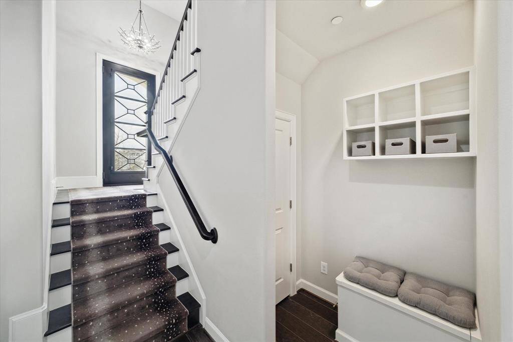 Enter the garage and appreciate the first floor drop zone.  Cubbies and bench seating for convenience.  Spacious "under stair" storage.