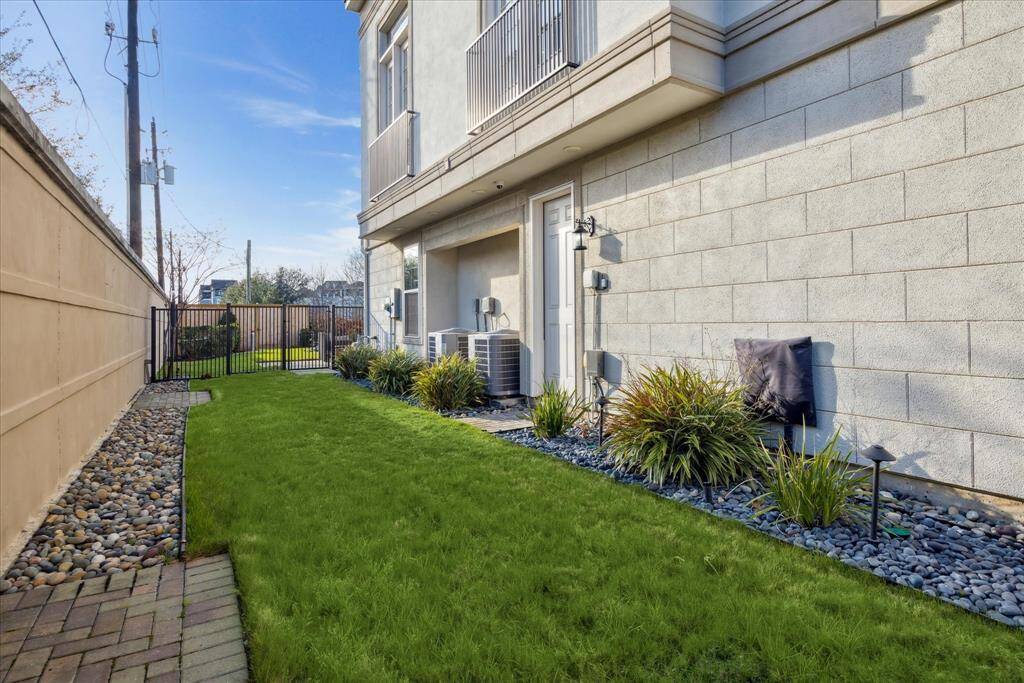 One of the additional advantages of the corner location is the large, fenced in side yard. Plenty of room for kids to play or pets to roam. Convenient access gates from the front and back and door into garage.