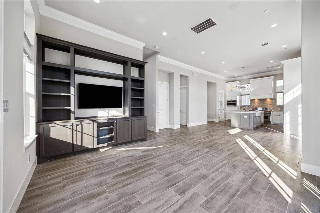 The heart of the residence is here on the second floor.  Open concept joins the living, dining and kitchen.
