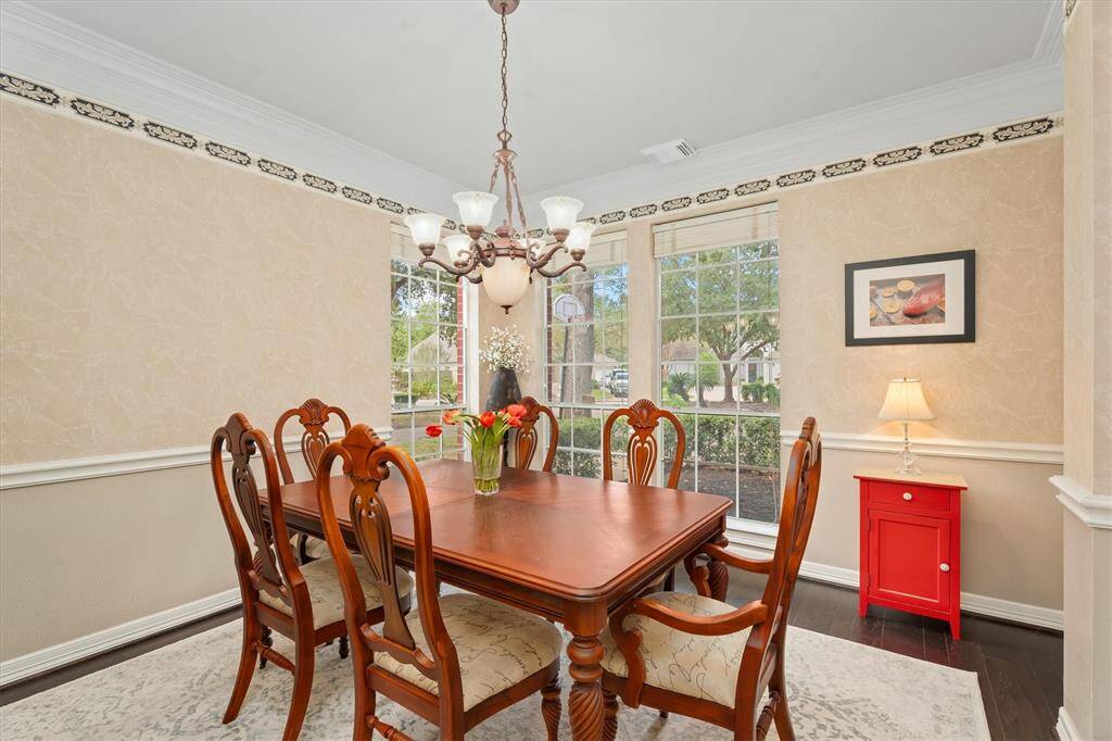 Elegant dining space with abundant natural light, perfect for hosting memorable dinners.