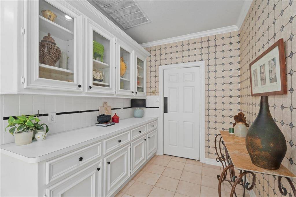 Experience the charm of this spacious galley kitchen, perfect for entertaining guests with ease.