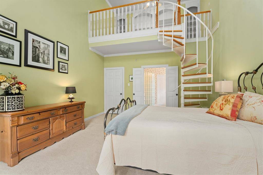 Discover the luxury of space in this expansive primary suite, complete with a charming loft area.