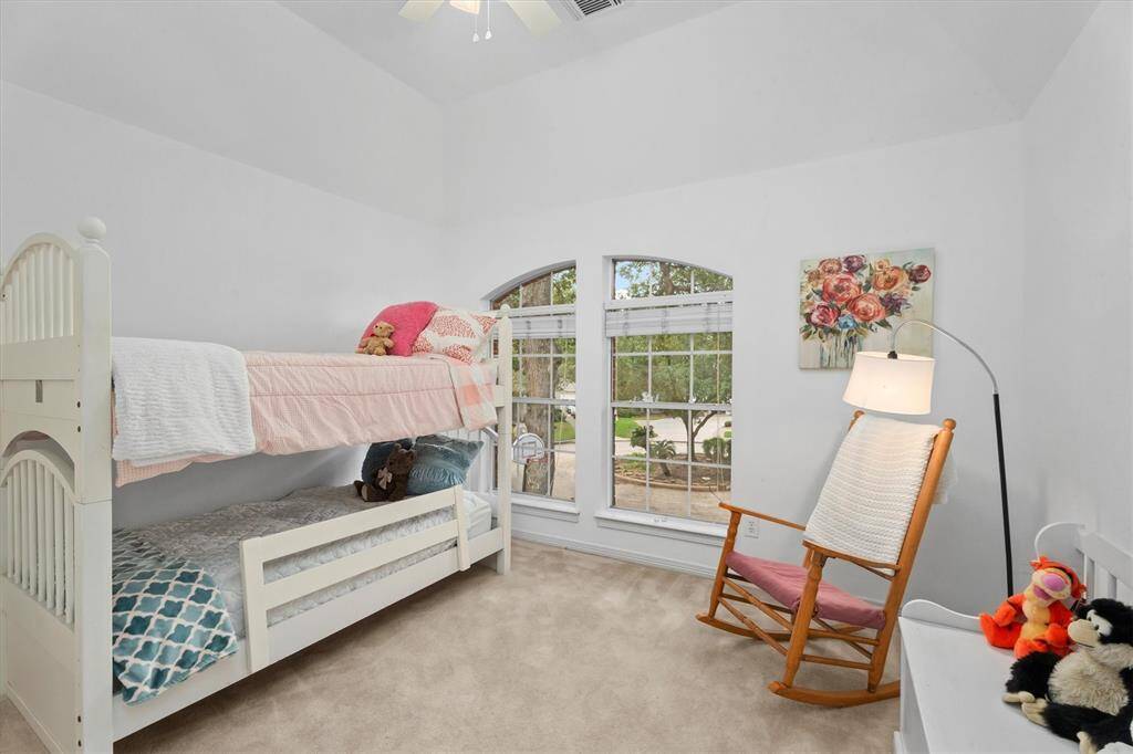 Charming front-facing secondary bedroom with ample natural light, added ceiling fan and freshly painted. This room has access to the Jack and Jill bathroom with it's own sink.