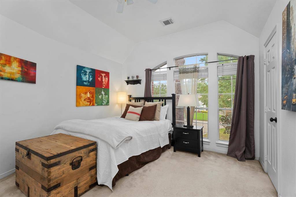Discover serene comfort in the upper-level third bedroom, boasting a spacious walk-in closet and an exclusive en-suite bathroom for ultimate privacy and convenience.