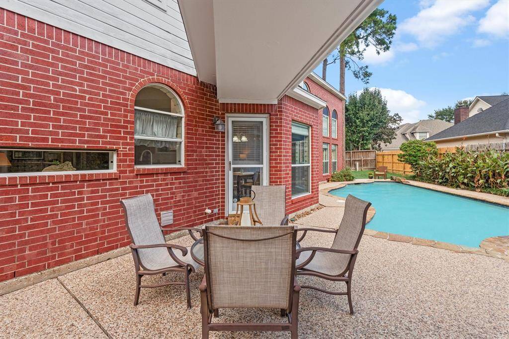 Enjoy a charming pathway leading to your private, spacious garage.