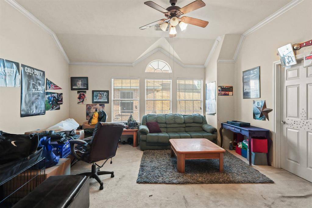 Upstairs game room with vaulted ceilings