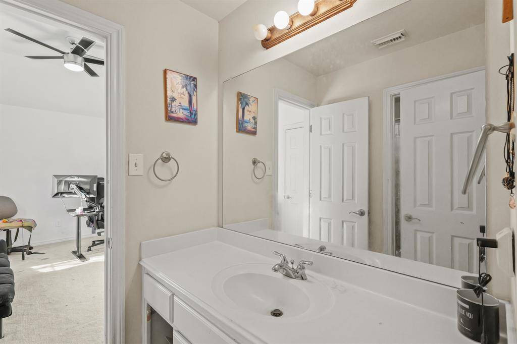 Connecting bathroom with vanity area