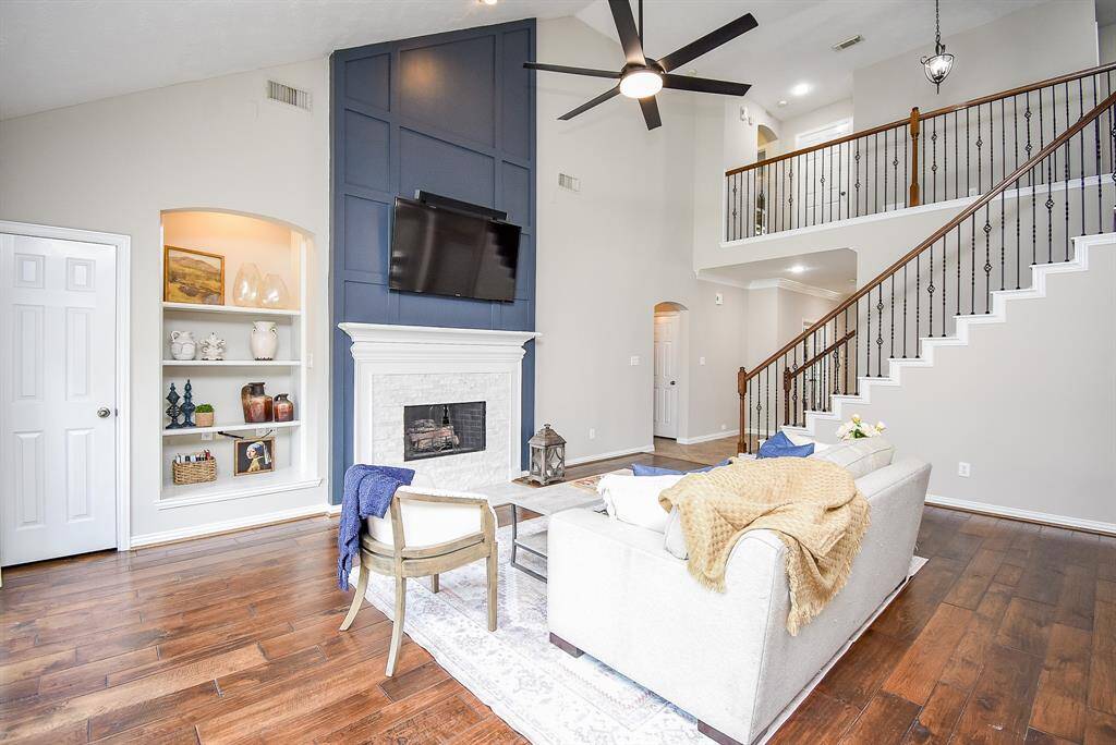 Built-in shelving enhances the space with charm and functionality, making this the perfect area for relaxation and entertaining.