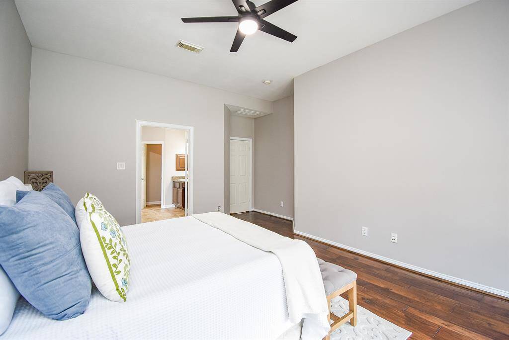 The suite's layout ensures privacy while maintaining a seamless flow to the luxurious en-suite bathroom. This tranquil retreat is the perfect space to unwind and recharge after a long day.