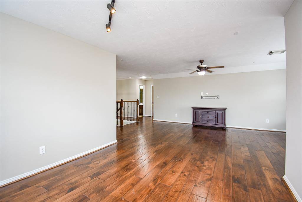 This expansive upstairs game room offers the perfect blend of function and versatility.