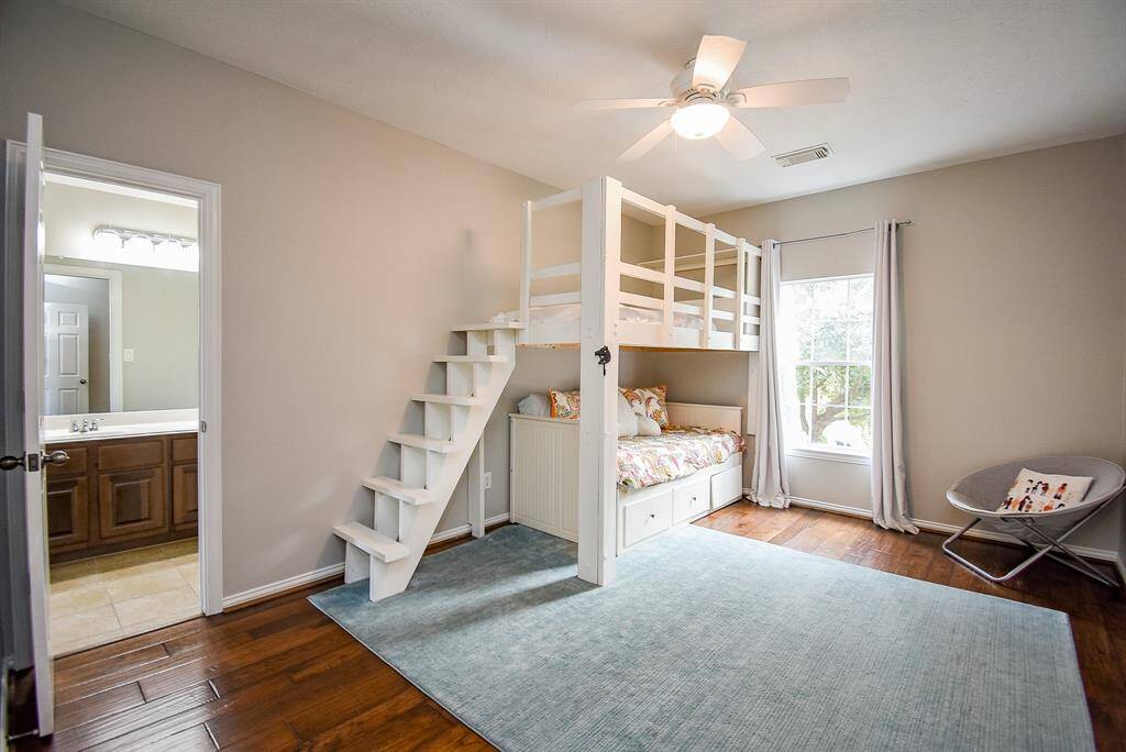 Featuring a custom-built loft bed with an integrated staircase, the room maximizes space while offering a playful yet functional design.