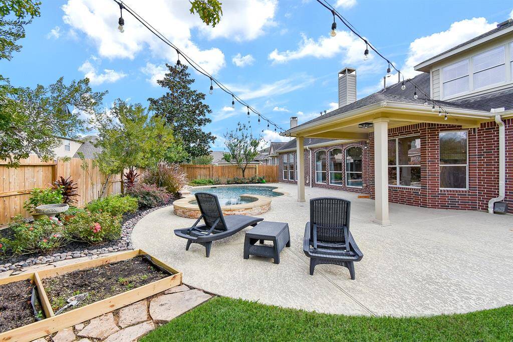 A fully fenced yard ensures privacy and security, while the additional green space allows for recreational activities or gardening.