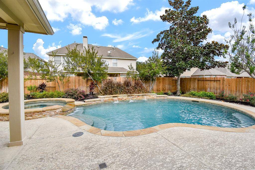 Stunning backyard oasis is perfect for outdoor entertaining & relaxation.