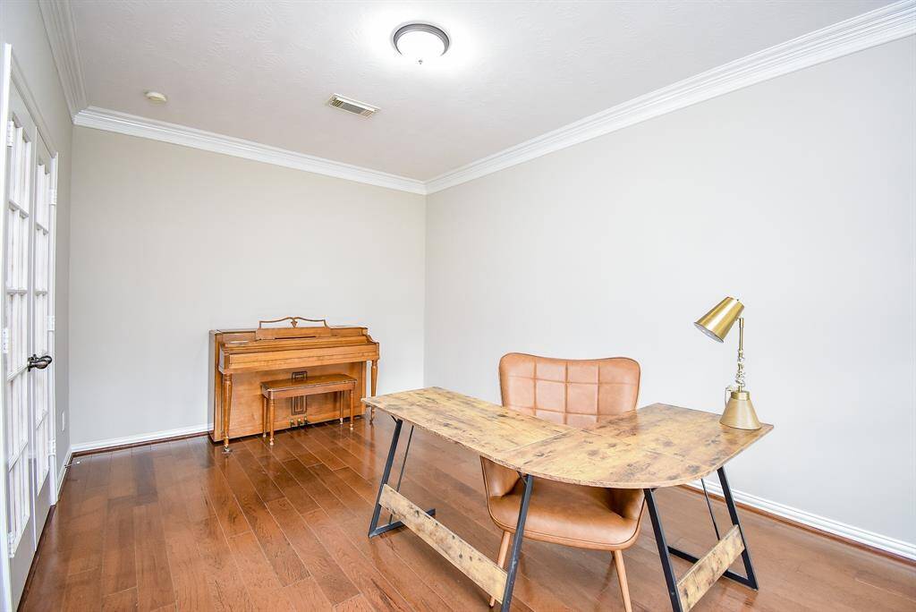 The spacious office layout easily accommodates a desk, bookshelves, or additional seating, making it a highly adaptable space to fit your needs. Whether used as a home office, reading room, or music space, this study is a standout feature of this home.