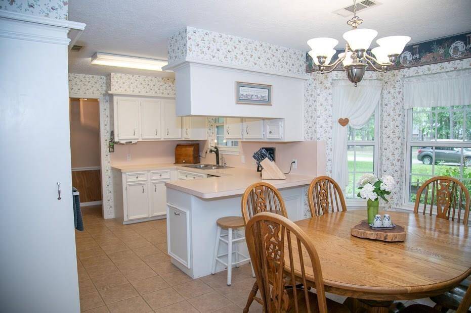 Dining room area , viewing adjacent kitchen.