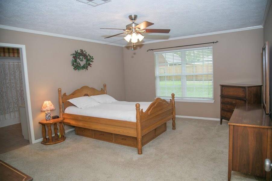 Master bedroom viewing large back yard.