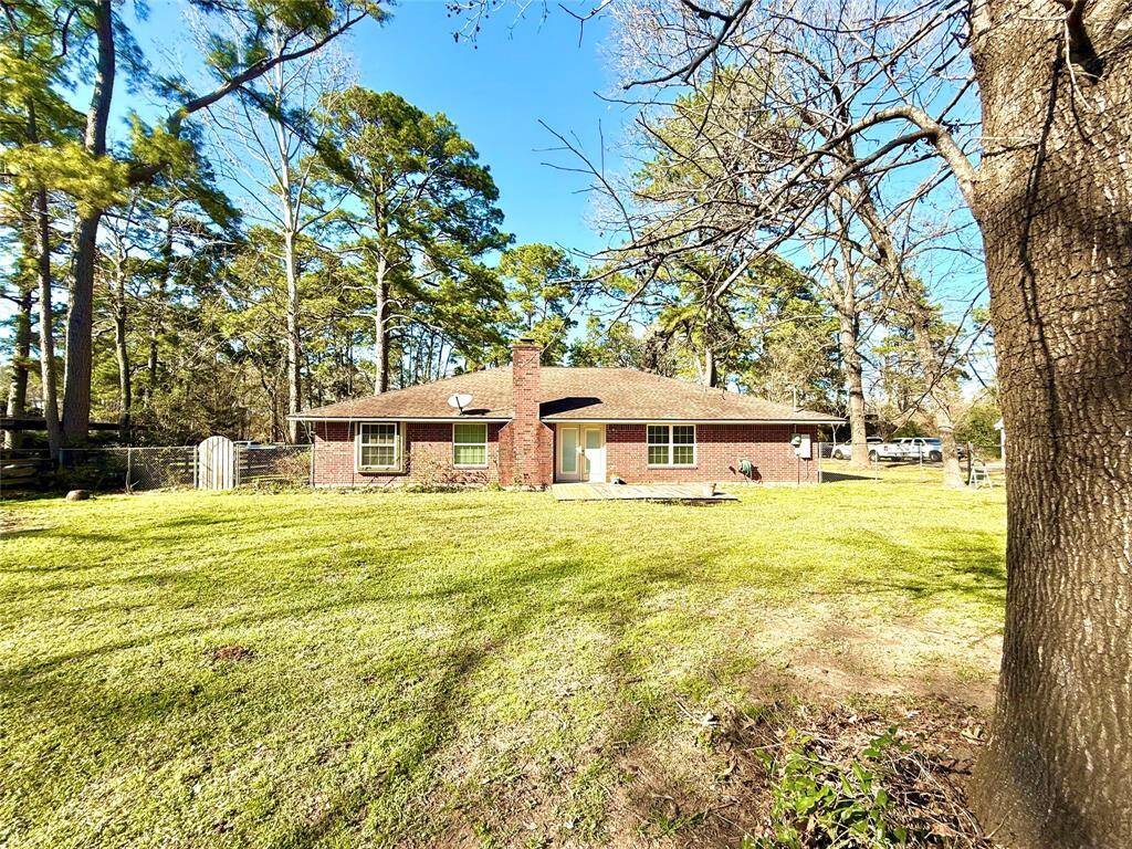 Amazing backyard showcasing majestic tress and large yard