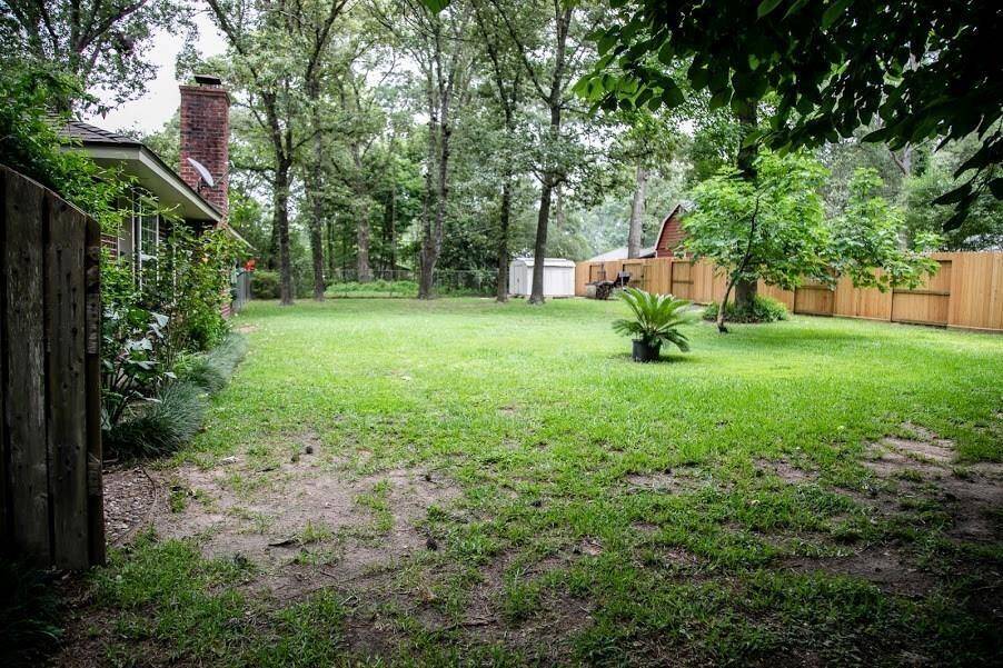 View of large backyard from the west showing storage building.