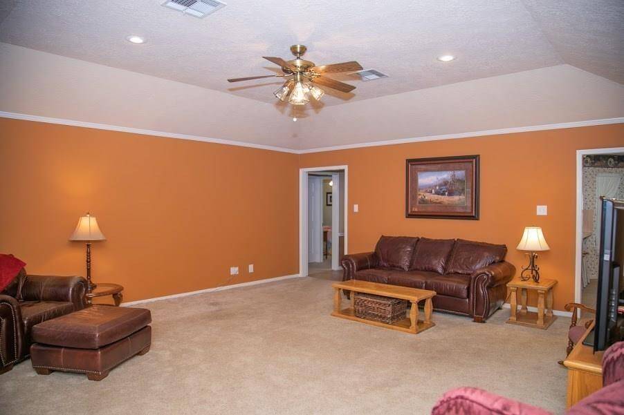 Large family room looking to front of home.