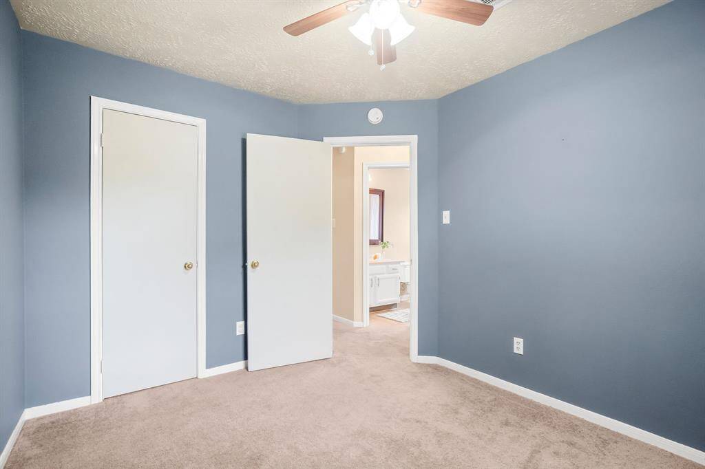 Bedroom features a ceiling fan and nice-sized closet