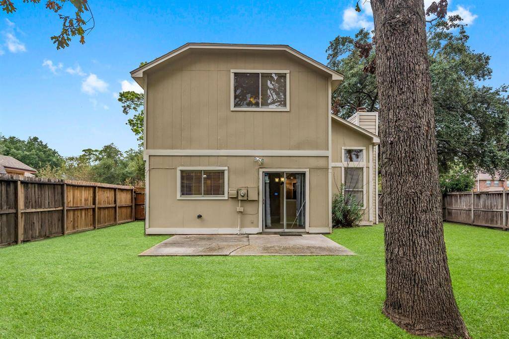 The large concrete patio provides plenty of space for grilling and outdoor dining