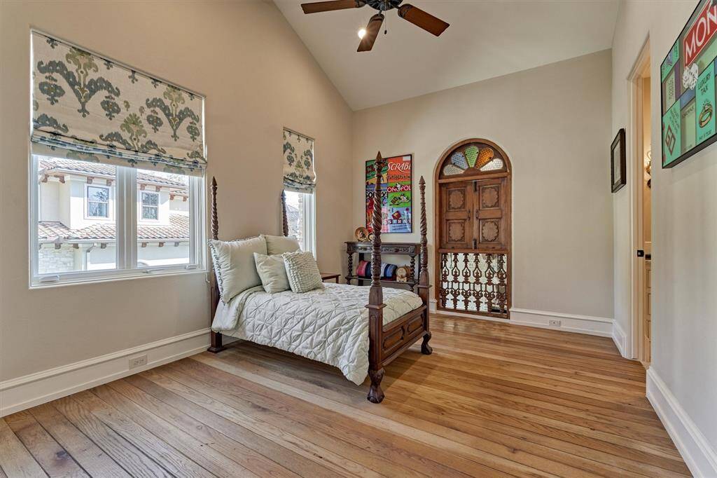 Juliet doors from Italy open to view living area below, and accentuate the old world theme throughout the residence.