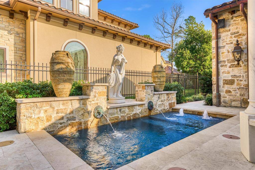 Main home's courtyard creates an inviting outdoor retreat with heated cocktail pool, outdoor kitchen,  and convenient access to foyer, living area, primary bedroom, and casita.