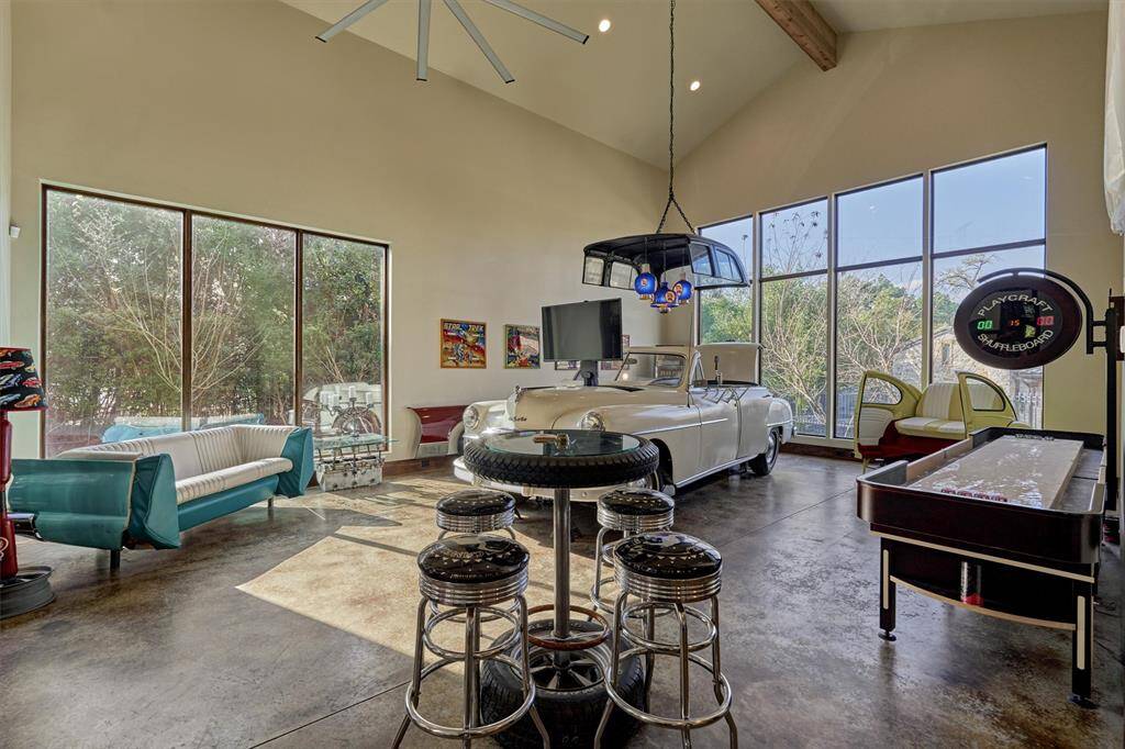 Gathering room adjoins dining as well as 4 garage bays.