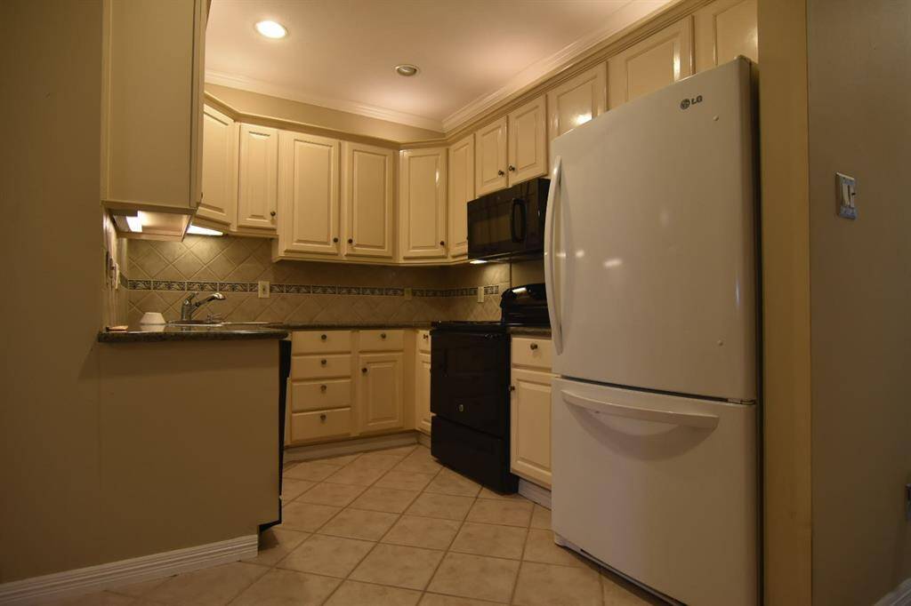 Updated kitchen cabinets and granite countertops