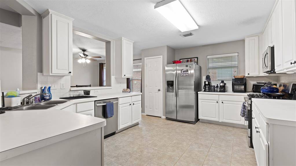 Kitchen with neutral colors and stainless appliances
