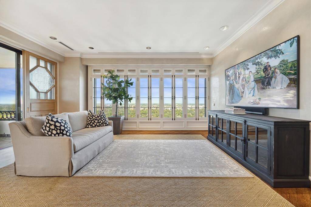 Enjoy seamless indoor-outdoor living with two sets of wide sliding doors opening to the home’s terrace.