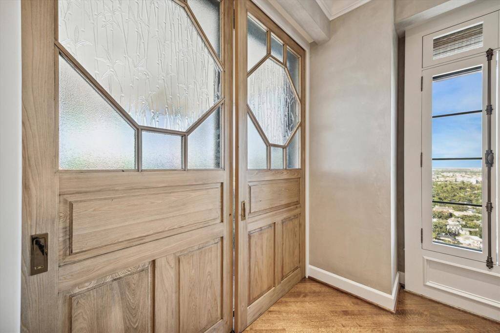 Custom wood-and-glass sliding doors reveal the home’s exceptional terrace.