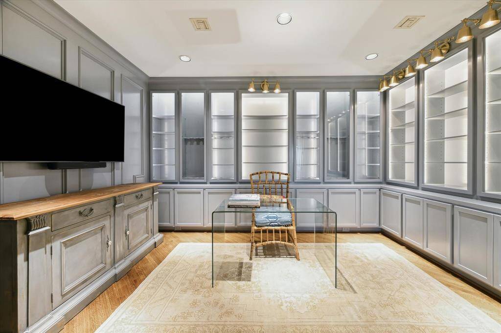 A hidden closet adds discreet storage to this inviting space.